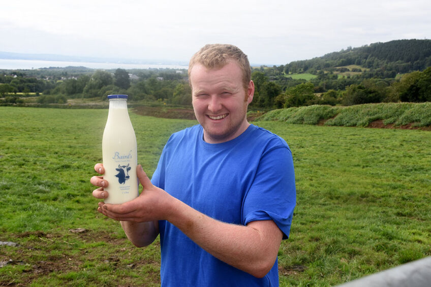 Gareth Baird from Carnrassie Farm with the glass bottled milk. Photo: Chris McCullough