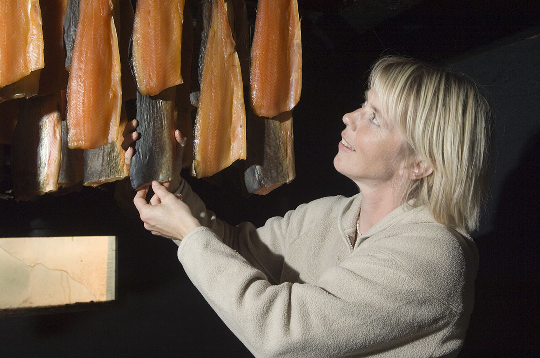 Farm manager Olof Hallgrimsdottir checks on some smoked fish for the restaurant.