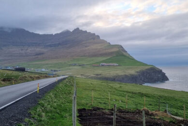 Roi's farm is situated (on the right of photo) just below Kap Enniberg on the north of the island. Photo: Chris McCullough