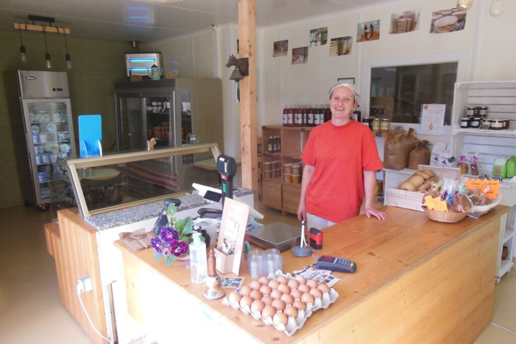 Mathilde, Nicolas’ companion, sells cheese in the factory's shop. Cottage cheese and yoghurts are also made on the farm and sold as well as other dairy products from other farms. Photo: Philippe Caldier