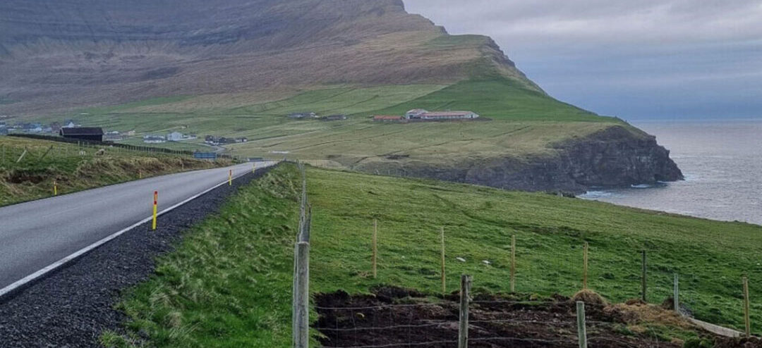 Roi's farm is situated (on the right of photo) just below Kap Enniberg on the north of the island. Photo: Chris McCullough