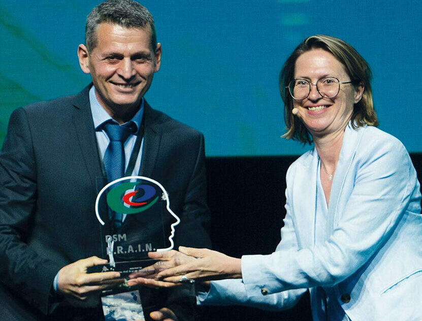 Professor Qendrim Zebeli accepts the BRAIN award on stage at the 2023 World Nutrition Forum. Photo: DSM-Firmenich