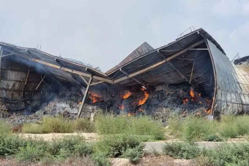 Hamas fighters torched this hay barn on one of the kibbutz farms.